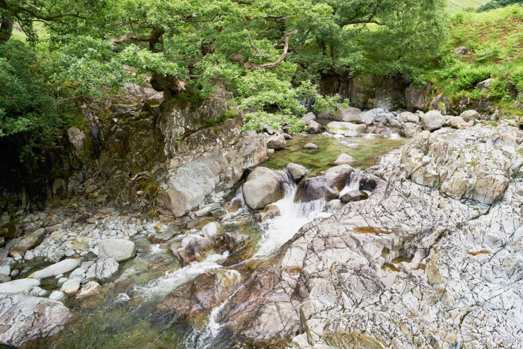 Fast flowing clear water of Galleny Force near Stonethwaite in the English Lake District-min