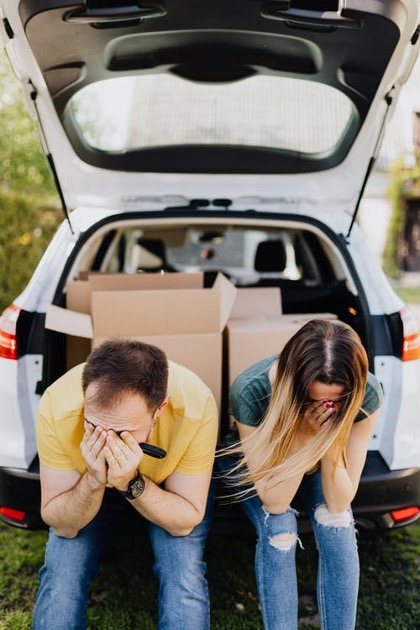 people sat in boot of car